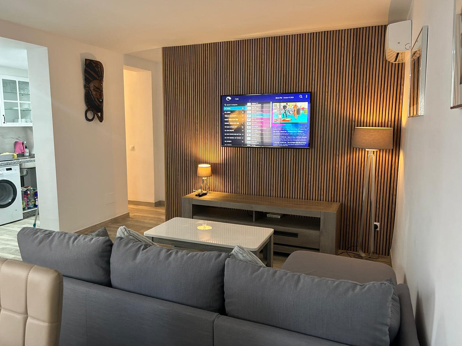 Living room featuring timber wall cladding