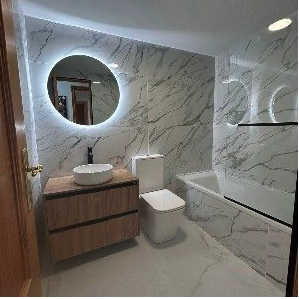 Bathroom renovation with modern tiling and fittings